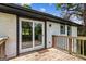 Back patio with wooden railing and sliding glass door at 2835 Laguna Dr, Decatur, GA 30032