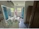 Bright bathroom featuring double sinks, unique blue tile floor, and a window for natural light at 4540 Lindsey Dr, Powder Springs, GA 30127