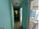 Hallway with view into the adjacent rooms, offering a sense of openness and connectivity at 4540 Lindsey Dr, Powder Springs, GA 30127