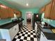 Well-appointed kitchen with modern appliances and stylish black and white checkered flooring at 4540 Lindsey Dr, Powder Springs, GA 30127