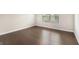 Bedroom with a hardwood floor and window with blinds at 8041 Louis Dr, Locust Grove, GA 30248