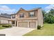 Side view of a brick and siding home featuring a well-kept lawn and an attached three-car garage at 8041 Louis Dr, Locust Grove, GA 30248