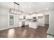 This modern kitchen features stainless steel appliances, white cabinetry and a view to the backyard at 8041 Louis Dr, Locust Grove, GA 30248