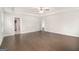 Spacious living room featuring hardwood floors and a ceiling fan at 8041 Louis Dr, Locust Grove, GA 30248