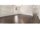 Spacious living room features hardwood floors, a modern light fixture and great natural light at 8041 Louis Dr, Locust Grove, GA 30248