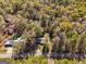 A lush, expansive community surrounding a charming home with a long driveway and proximity to main road at 465 Haynie Rd, Moreland, GA 30259
