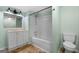 Well-lit bathroom with a tub and shower combination and white fixtures at 465 Haynie Rd, Moreland, GA 30259