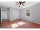 Bedroom with wood-look floors, ceiling fan, natural light and closet at 465 Haynie Rd, Moreland, GA 30259