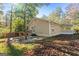 Home exterior featuring a covered patio, fenced yard and shed for outdoor living and storage at 465 Haynie Rd, Moreland, GA 30259