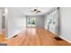 Versatile living room with wood-look floors, bright windows, and access to the backyard through glass doors at 465 Haynie Rd, Moreland, GA 30259
