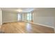 Cozy living room features light gray walls, wood floors and a neutral color palette at 465 Haynie Rd, Moreland, GA 30259