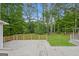 Backyard deck overlooking a beautiful yard with mature trees at 2090 Blackberry Ln, Auburn, GA 30011