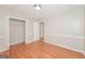Bedroom with hardwood floors, a closet and neutral paint at 2090 Blackberry Ln, Auburn, GA 30011