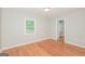 Bedroom with hardwood floors and natural light from the window at 2090 Blackberry Ln, Auburn, GA 30011