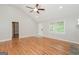 Spacious living room with hardwood floors and abundant natural light from a large window at 2090 Blackberry Ln, Auburn, GA 30011