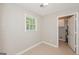 Functional utility room with a window and view of the water heater behind an open door at 2090 Blackberry Ln, Auburn, GA 30011