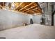 Unfinished basement with concrete walls, exposed beams, and mechanical systems at 917 Saints Ct, Marietta, GA 30068