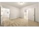 Bedroom with neutral carpeting and two doorways at 917 Saints Ct, Marietta, GA 30068