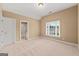 A bright room features a window with neighborhood views, neutral walls and carpet, plus a bathroom at 917 Saints Ct, Marietta, GA 30068