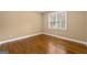 Bedroom with wood floors and a window providing natural light at 917 Saints Ct, Marietta, GA 30068