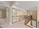 Upstairs hallway features carpet, wood railing, and a decorative coffered ceiling at 917 Saints Ct, Marietta, GA 30068