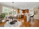 Well-lit kitchen with wood cabinets, dining table and stools at 917 Saints Ct, Marietta, GA 30068