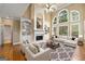 Inviting living room with large windows, built-in shelving, and a cozy fireplace at 917 Saints Ct, Marietta, GA 30068