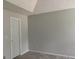 Spacious, neutral bedroom with standard door and trim at 135 Green Commons Dr, Covington, GA 30016