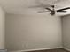 Spacious bedroom with neutral walls and carpet, highlighted by a modern ceiling fan at 135 Green Commons Dr, Covington, GA 30016