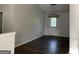 Open living room featuring modern lighting and a bright entry door with side window at 135 Green Commons Dr, Covington, GA 30016