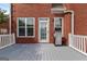 Outdoor deck area for entertaining includes stainless steel gas grill and a brick home exterior at 1979 Spivey Village Dr, Jonesboro, GA 30236