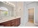 Bathroom vanity features double sinks, a large mirror, and updated fixtures at 1979 Spivey Village Dr, Jonesboro, GA 30236
