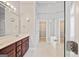 Bathroom boasts double vanity with soaking tub and walk-in shower at 1979 Spivey Village Dr, Jonesboro, GA 30236