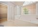 Bathroom boasts soaking tub and glass-enclosed shower at 1979 Spivey Village Dr, Jonesboro, GA 30236