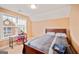 Cozy bedroom showcasing a large window and neutral colored walls at 1979 Spivey Village Dr, Jonesboro, GA 30236