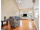 Well-lit living room with hardwood floors, neutral walls and vaulted ceiling at 1979 Spivey Village Dr, Jonesboro, GA 30236