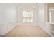 Bright room with a vaulted ceiling, large window, and neutral wall and carpet colors at 1979 Spivey Village Dr, Jonesboro, GA 30236