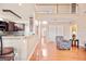 Inviting living space with hardwood floors, view of staircase and open to kitchen at 1979 Spivey Village Dr, Jonesboro, GA 30236