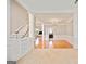 Open-concept living room with hardwood floors, staircase and natural light at 1979 Spivey Village Dr, Jonesboro, GA 30236