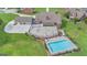 Aerial view of outdoor pool, patio, and an expansive green lawn at 1979 Spivey Village Dr, Jonesboro, GA 30236