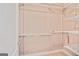 Walk-in closet with door and multiple shelving racks installed at 1979 Spivey Village Dr, Jonesboro, GA 30236