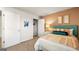 Bedroom featuring an accent wall, queen bed, and walk-in closet at 11893 Aukerman Way, Hampton, GA 30228