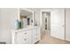 Bedroom featuring a dresser with modern decor and a view to the hall at 11893 Aukerman Way, Hampton, GA 30228