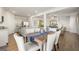 Open concept dining room with seating for six and kitchen view at 11893 Aukerman Way, Hampton, GA 30228