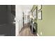 Inviting hallway with wood floors, leading to various rooms and storage space at 11893 Aukerman Way, Hampton, GA 30228