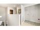 Bright laundry room with white walls, open shelving, and an open door at 11893 Aukerman Way, Hampton, GA 30228