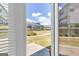 View of the backyard area from inside the house, featuring a view of the community at 2060 Lanier Harbor Pt, Buford, GA 30518
