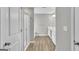 A bathroom with a glass shower, a bath tub, vinyl flooring, and double sinks at 2060 Lanier Harbor Pt, Buford, GA 30518