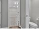 The bathroom features a walk-in closet, vinyl flooring, and a toilet at 2060 Lanier Harbor Pt, Buford, GA 30518