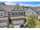Beautiful two story home with a two car garage, brick and siding, shuttered windows and well maintained landscaping at 2060 Lanier Harbor Pt, Buford, GA 30518
